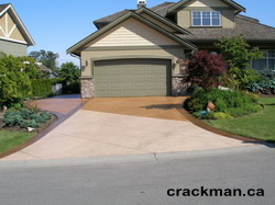 The Crackman custom tints your concrete driveway