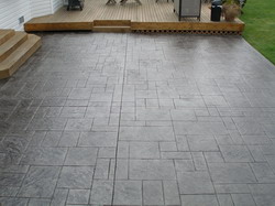 The Crackman custom tints your concrete driveway