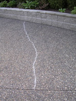 BEFORE exposed concrete aggregate Crack Repair...