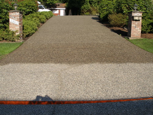 The Crackman custom tints your concrete driveway